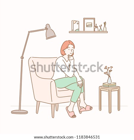 A girl sitting on a sofa in a room with a stand lamp and a small table. hand drawn style vector design illustrations.