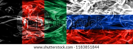 Afghanistan vs Russia smoke flags placed side by side. Thick colored silky smoke flags of Afghani and Russia
