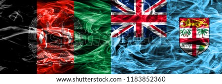 Afghanistan vs Fiji smoke flags placed side by side. Thick colored silky smoke flags of Afghani and Fiji
