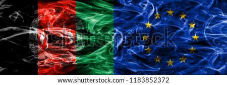 Afghanistan vs Eu smoke flags placed side by side. Thick colored silky smoke flags of Afghani and Eu