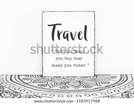 Bohemian vintage carpet travel quote travel is the only thing you buy that makes you ricer text on board white isolated wall background