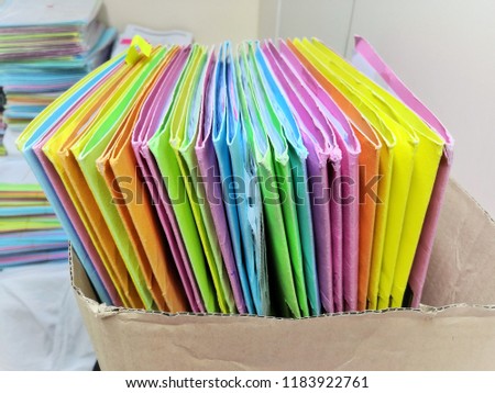 File documents multi-colored in brown box paper.