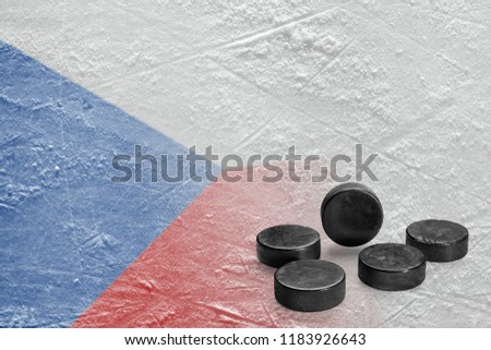 Image of the Czech flag on ice and hockey pucks. Concept, hockey, background