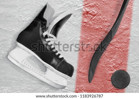 Hockey skates, putter and washer on ice. Concept, hockey, background