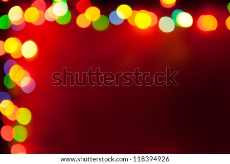 red background with frame of bokeh lights