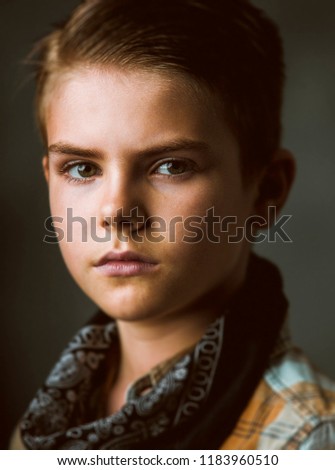 Americana styled portrait of young kid. "Americana" comprehends images that reflect the charm, nostalgia of  America’s past. The quintessential of the U.S.A culture and tradition.