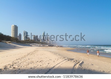 surfers paradise with beach in foreground and sea and blue sky in background