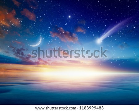 Amazing heavenly background - beautiful glowing sunset with falling comet - mystical sign in sky, rising crescent moon and stars. Elements of this image furnished by NASA