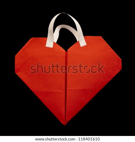 Red heart shopping bag with white handles.