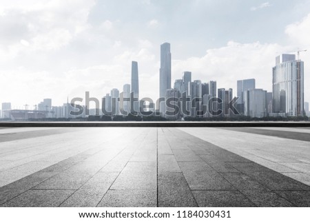City square platform and panoramic view of the city. Royalty-Free Stock Photo #1184030431