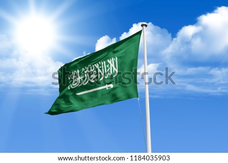 Saudi Arabia big realistic national flag waving in blue sky