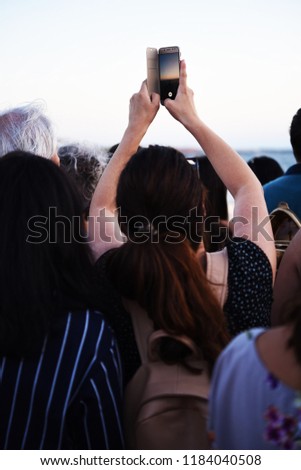 Woman At Outdoor Music Festival Using Mobile Phone