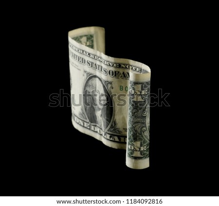 One dollar bill isolated on black background