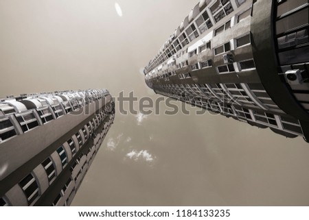 two black and white block of flats. bottom view.
