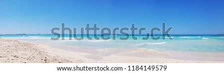 Panoramic view background beach with sea wave. Texture sand. Blue sky and azure coast. Gentle pastel colors. Relax atmosphere. Es trenc, Mallorca, Spain