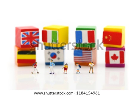Miniature people : students with international flag using for concept of World Student's Day.