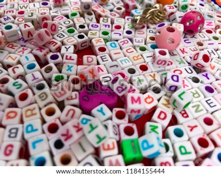 alphabet on white tiny cubes to create breslate with name