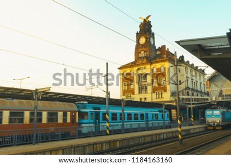 The train is standing at the train station in Prague against the background of the historic building