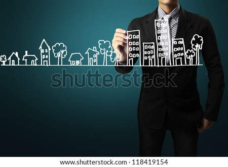 Business man drawing a house Royalty-Free Stock Photo #118419154