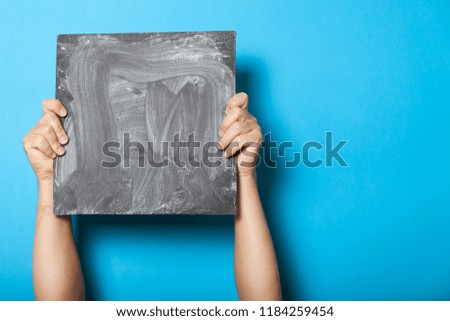 Placard chalkboard in hands, people showing. Advertisement poster, empty space for text.