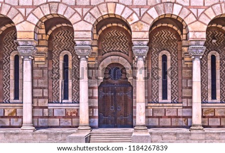 Close View of one of St. Mark Church's doors with arches, columns and ornaments in Belgrade - Serbia                         