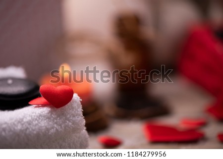 Wellness docoration on valentine's day with candels and stones