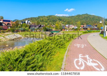Cycling lane along Grajcarek river and promenade in Szczawnica town, Pieniny Mountains, Poland