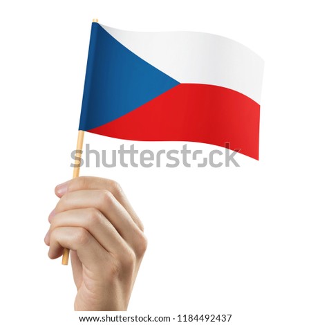 Hand holding flag of Czech Republic, isolated on white background