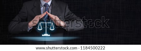 Legal protection concept with businessman in a protective gesture