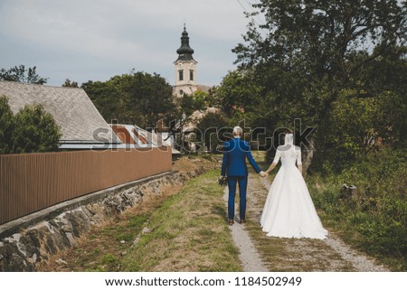 Beautiful wedding couple, wedding on village, rural church in background