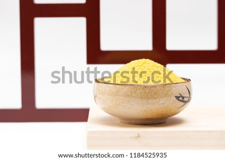 Yellow can of millet