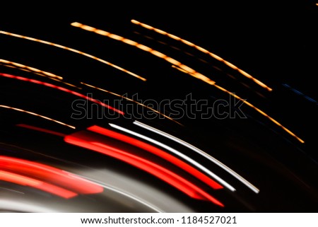 abstraction, arbitrary lines of light, the movement of particles, atoms and photons, light in motion, the perfect combination of colors