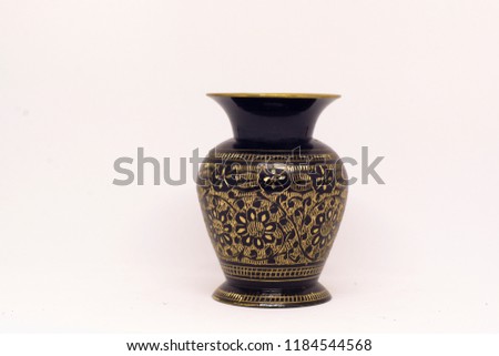 golden vase in a white background  Royalty-Free Stock Photo #1184544568