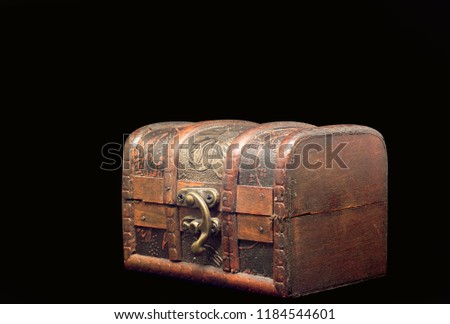 old wood box in a black background  Royalty-Free Stock Photo #1184544601