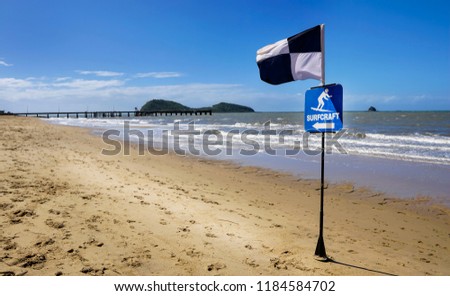 surfcraft exclusion zone depicted by a black and white quartered flag in Australia near Cairns