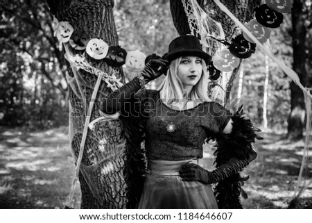 Elegant, charming, shy, playful, flirty, dangerous, mysterious, scary female beauty. Close up portrait of gorgeous happy witch fairy enchantress, covering her eyes, carnaval halloween concept