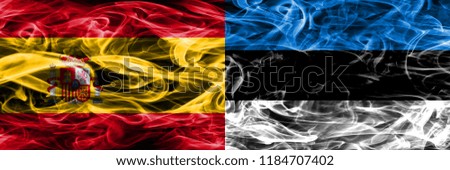 Spain vs Estonia smoke flags placed side by side. Thick colored silky smoke flags of Spanish and Estonia