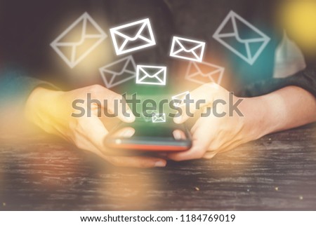 Woman hand using smartphone to send and recieve email. Business communication  technology concept.