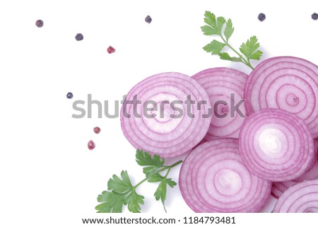 Rings of sliced red onions with herbs and spices on a white isolated background. vegetables. top view