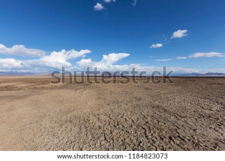 Soda Dry Lake in the middle of the Mojave Desert near Baker California.   Royalty-Free Stock Photo #1184823073