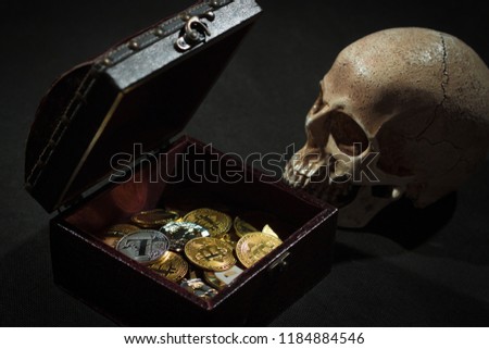 Pile of cryptocurrencies in a chest with skull over dark bacgkround