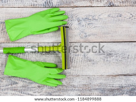 Cleaning tools lying on wood planks