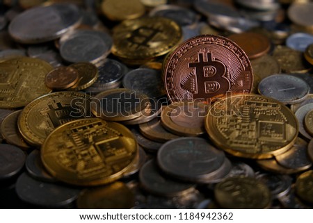 Physical version of Bitcoin (new virtual money). Exchange bitcoin for a dollar. Conceptual image for worldwide cryptocurrency and digital payment system.Golden Bitcoins. Ne
