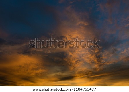Beautiful twilight sky with orange and blue colour dramatic cloud.
