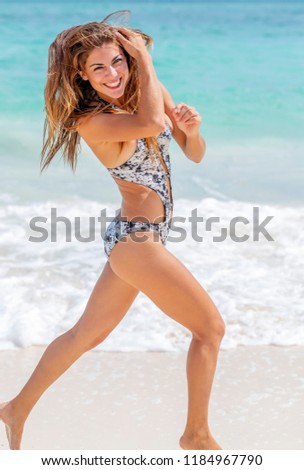 A hispanic brunette model enjoying a day at the beach
