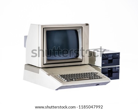 Vintage computer from the 80s on white background Royalty-Free Stock Photo #1185047992
