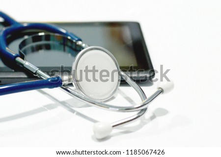 Medical equipment: Stethoscope  on tablet.