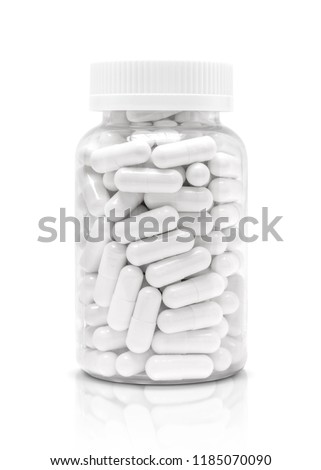 white medicine or supplement capsules in transparent plastic bottle isolated on white background with clipping path Royalty-Free Stock Photo #1185070090