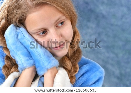 smiling girl in a blue on blue background