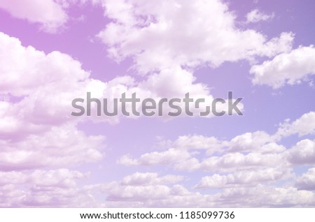 A blue sky with lots of white clouds of different sizes